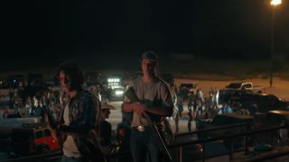 Armed men stand atop an oil platform on Landman