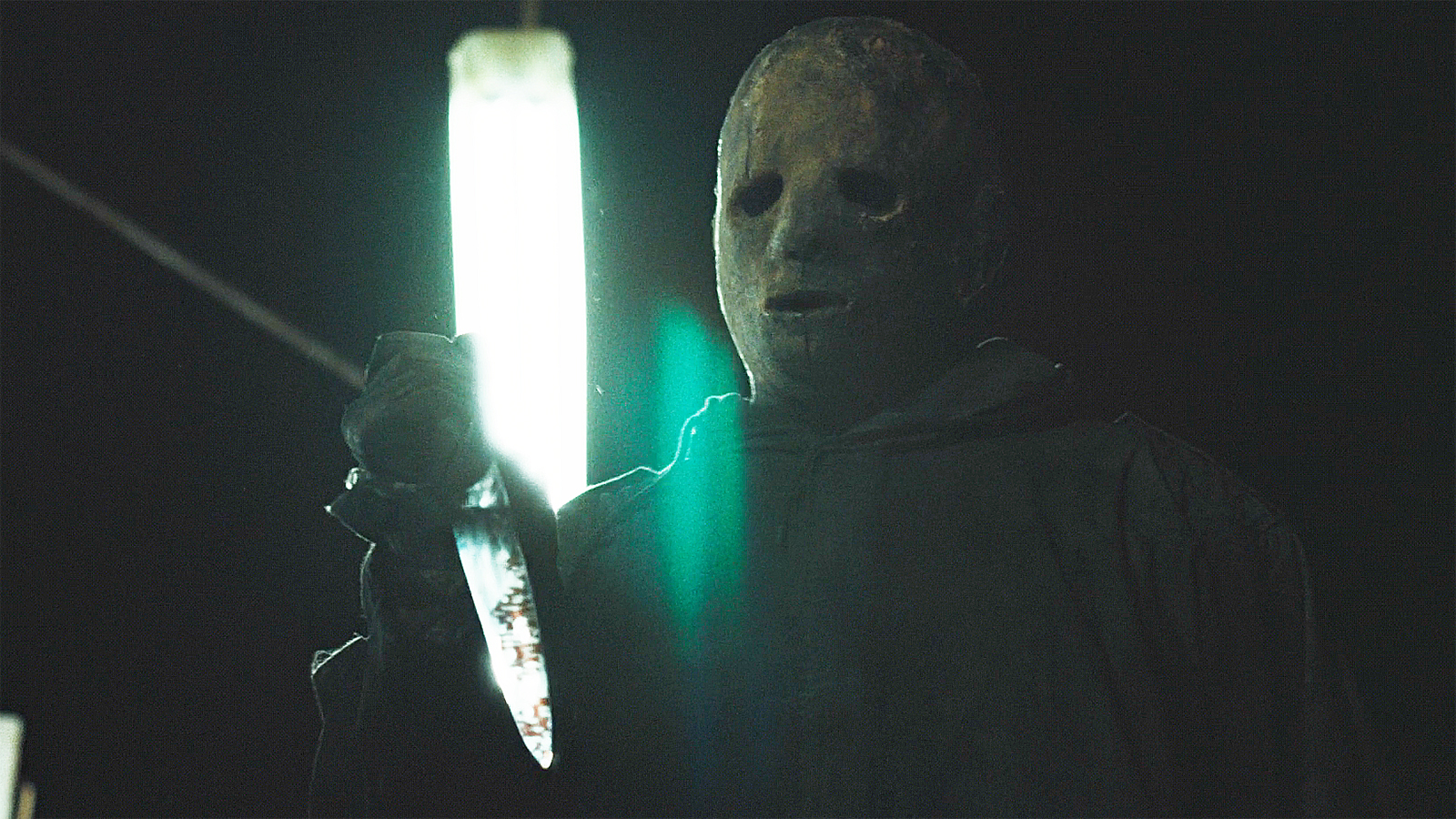 A close up of The Boogeyman holding a knife at night in Widow's Bay episode 8