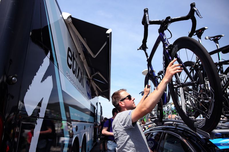 An Etixx-Quick Step mechanic with the team bikes