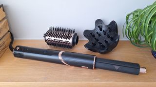 Shark FlexStyle in reviewer's home, with auto-wrap barrel attached and oval brush and diffuser sat behind it