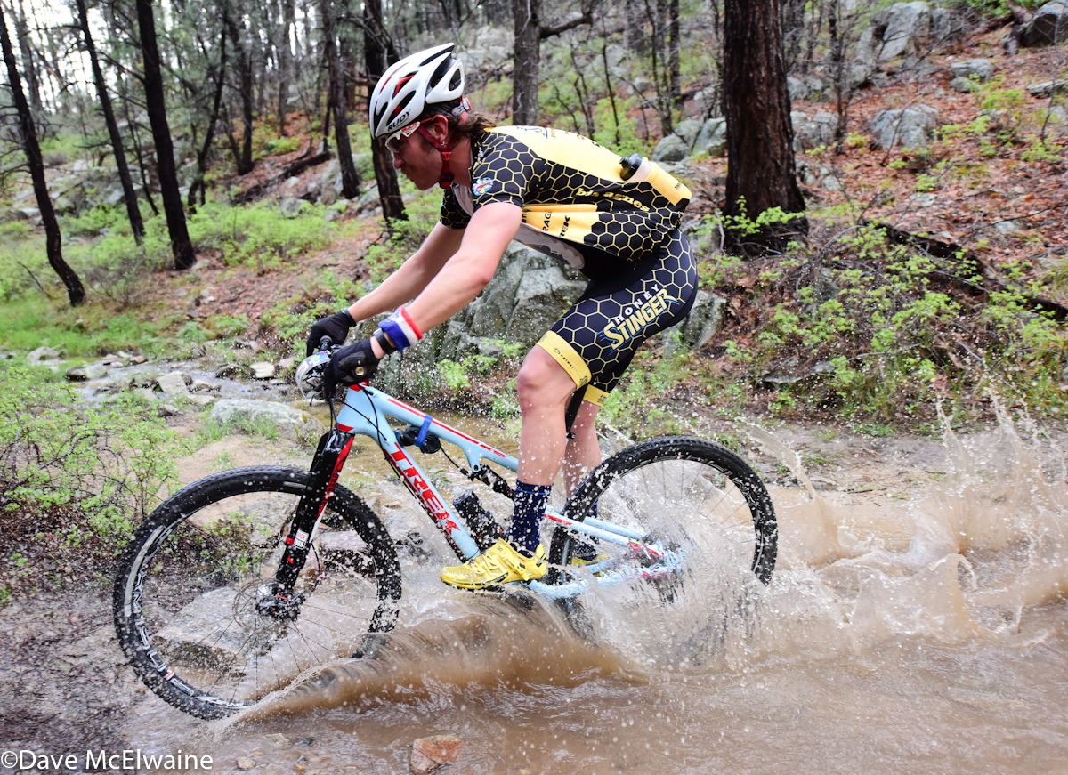 A Honey Stinger rider crossing one of the many streams