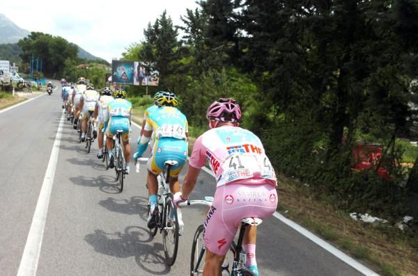 Race leader Alexandre Vinokourov holds his position in the line of Astana jerseys
