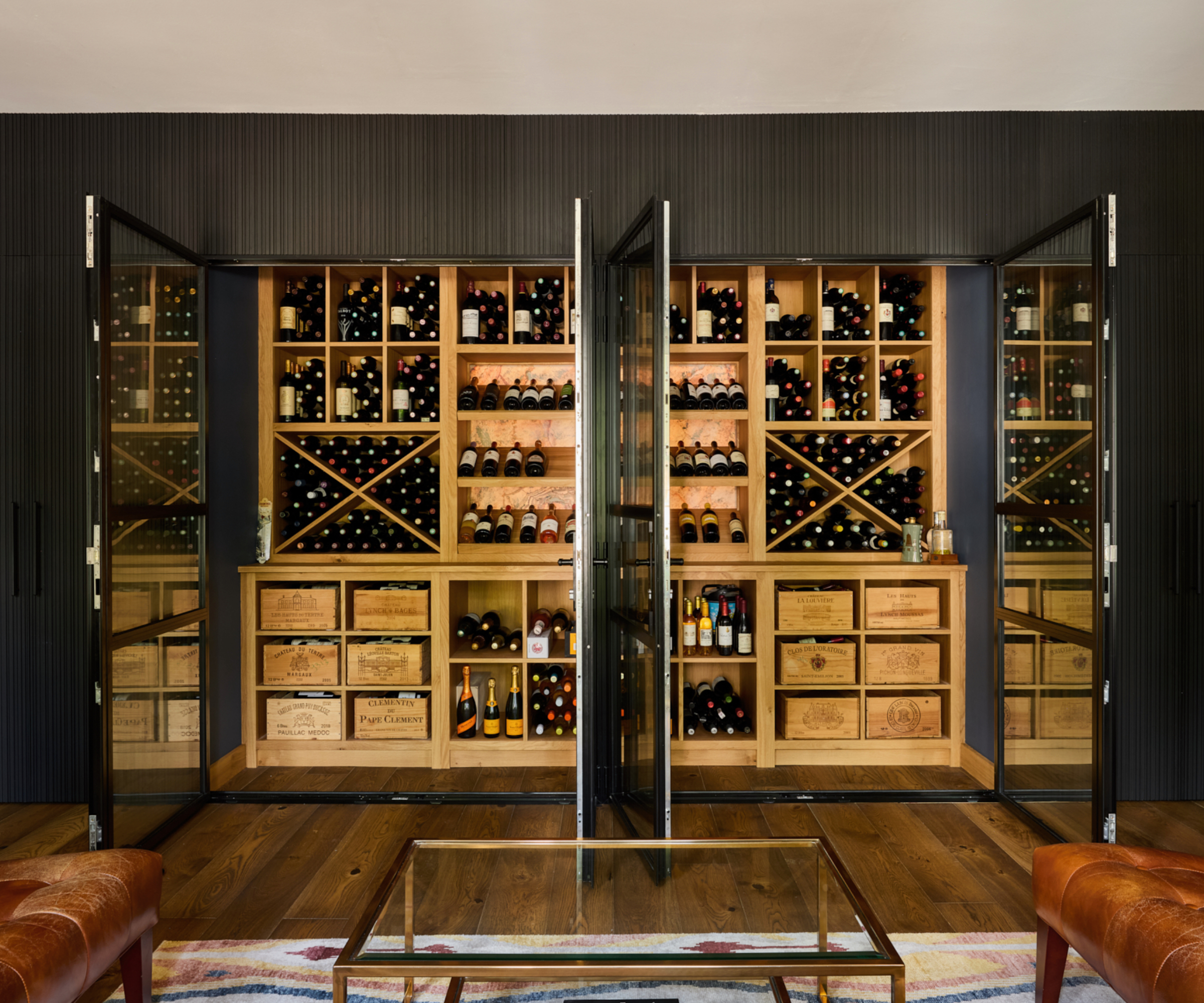 Built in wine cellar storage with two pairs of glass doors