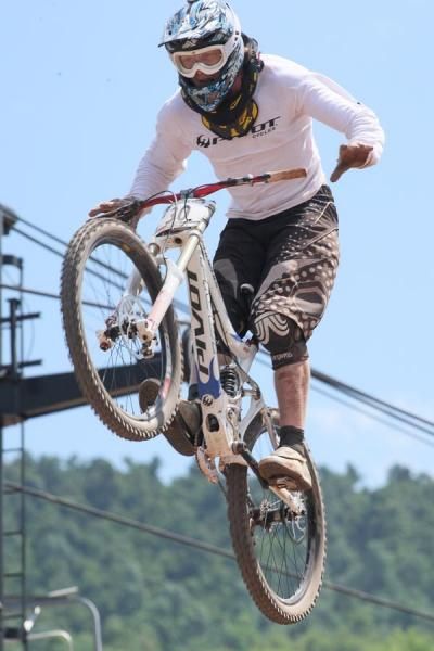 Bernard Kerr reaches for the bars before landing a crowd-pleasing jump.