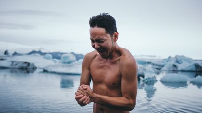 Man drying off after a cold ice bath and swim