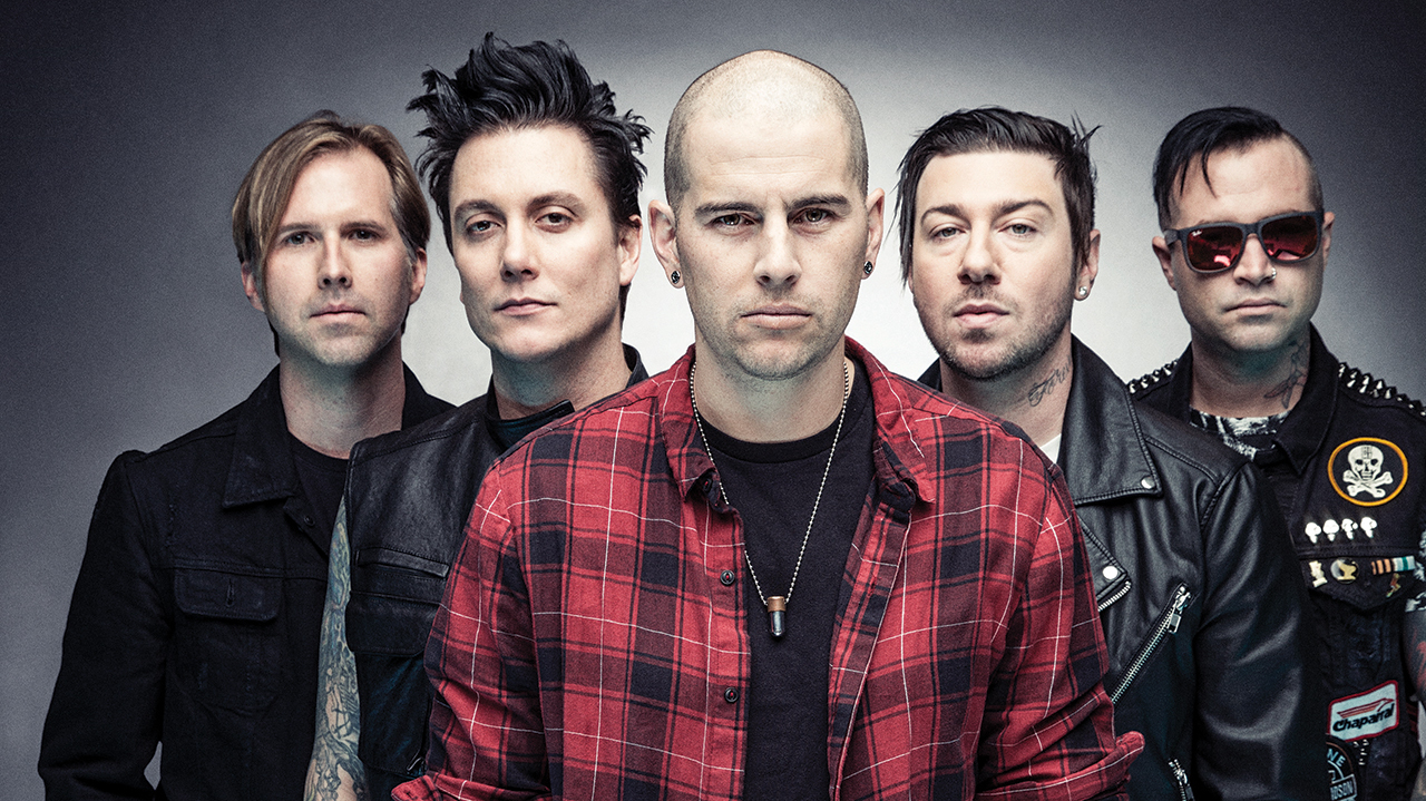 A studio portrait of Avenged Sevenfold looking into the camera