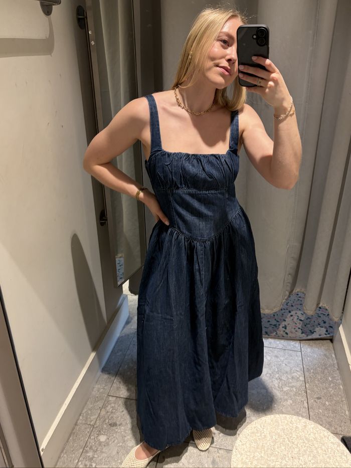 Woman wears denim dress