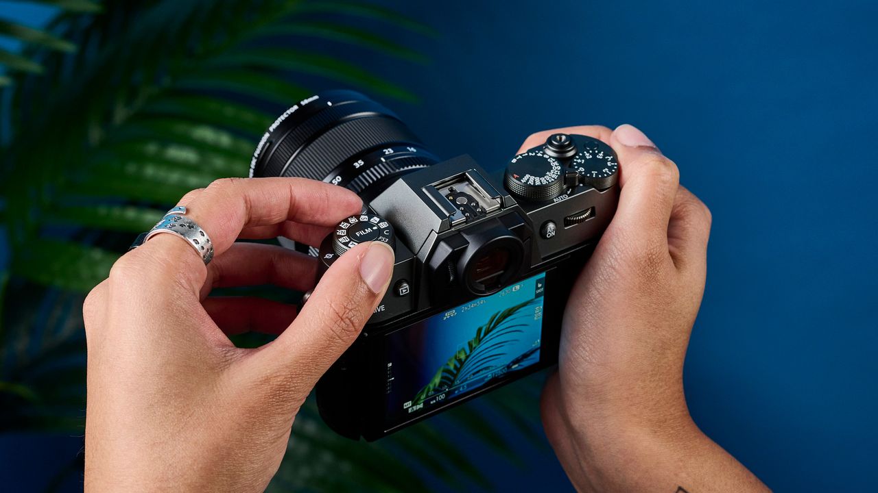 A Fujifilm X-T50 camera in the charcoal grey colorway