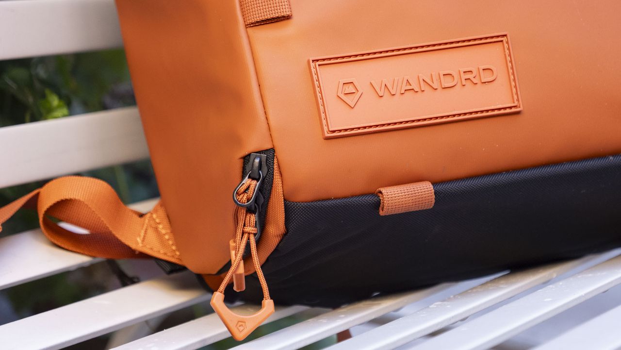Wandrd PRVKE V4 bag on a white metal bench