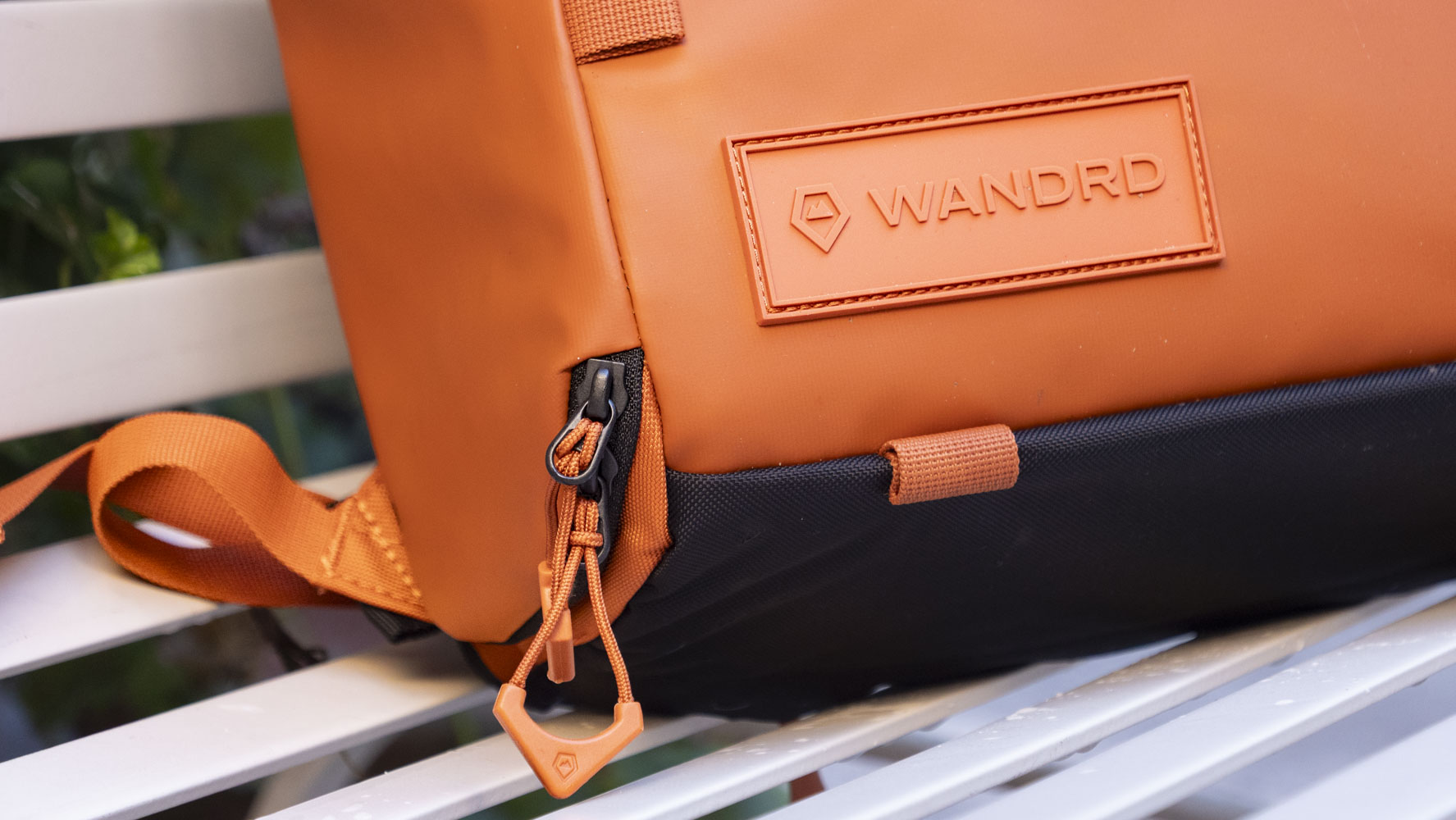 Wandrd PRVKE V4 bag on a white metal bench 
