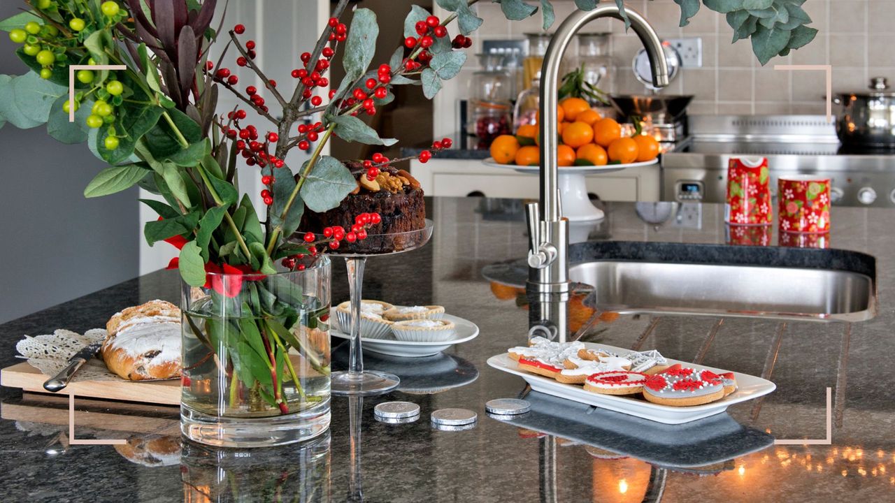 Christmas kitchen with a sink on the middle of the marble island