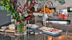 Christmas kitchen with a sink on the middle of the marble island