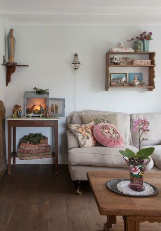 sofa-in-living-room-white-walls-orchid-nativity-scene