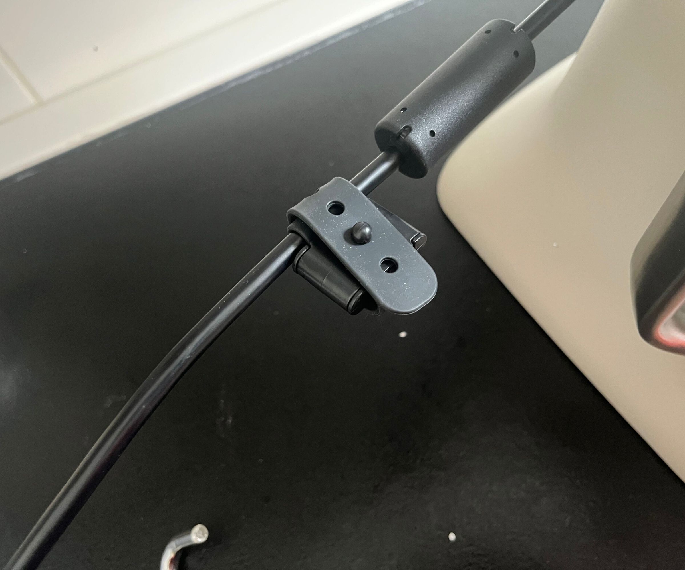 A close up of the black cable tie included on the KitchenAid Artisan Plus Stand Mixer