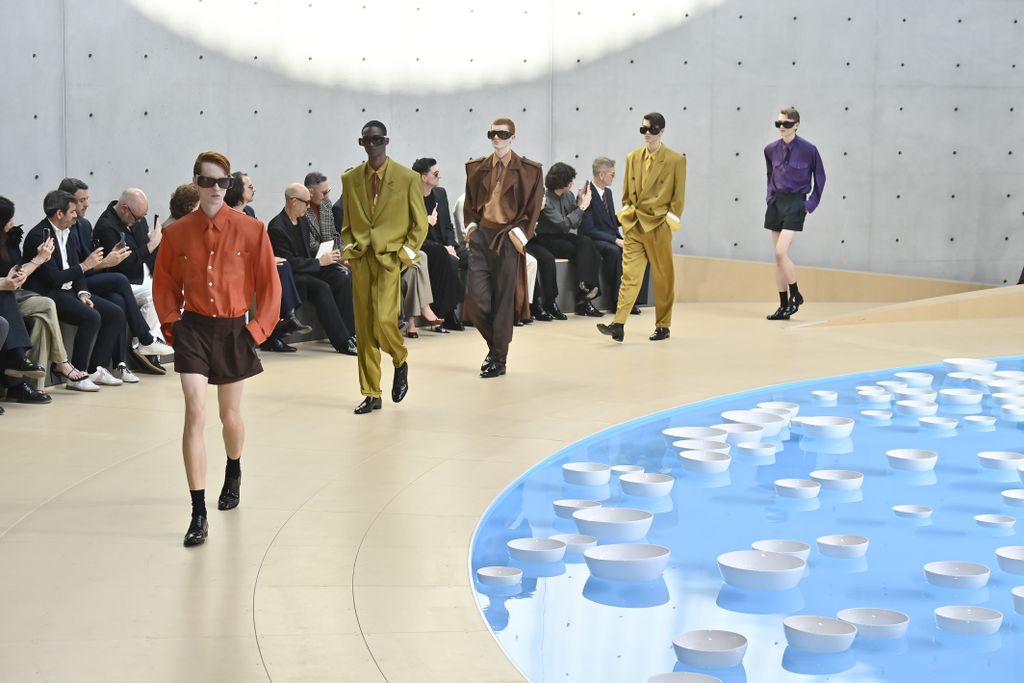 artwork of woman's body merging with desert landscape