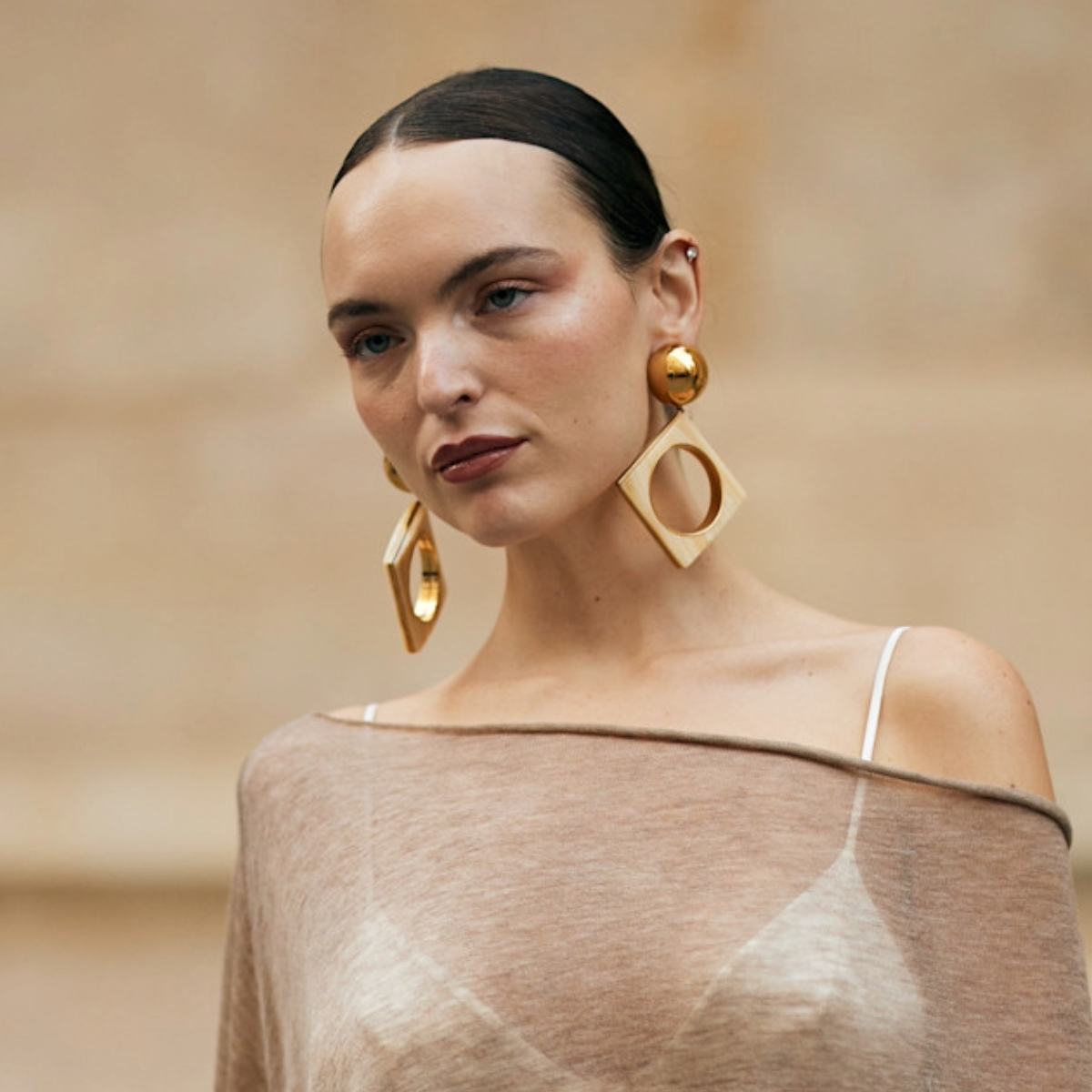 woman wearing sheer poncho in paris