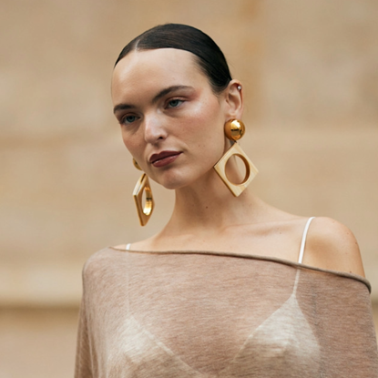woman wearing sheer poncho in paris