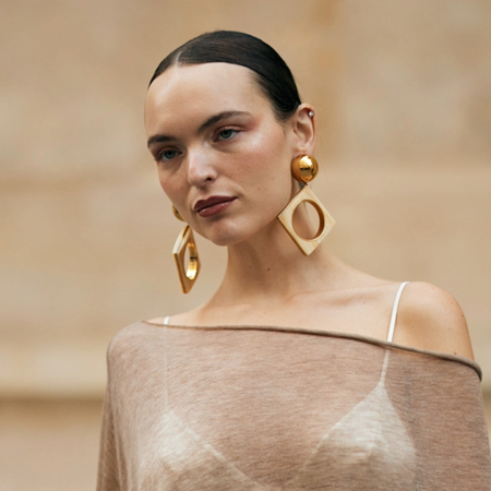 woman wearing sheer poncho in paris