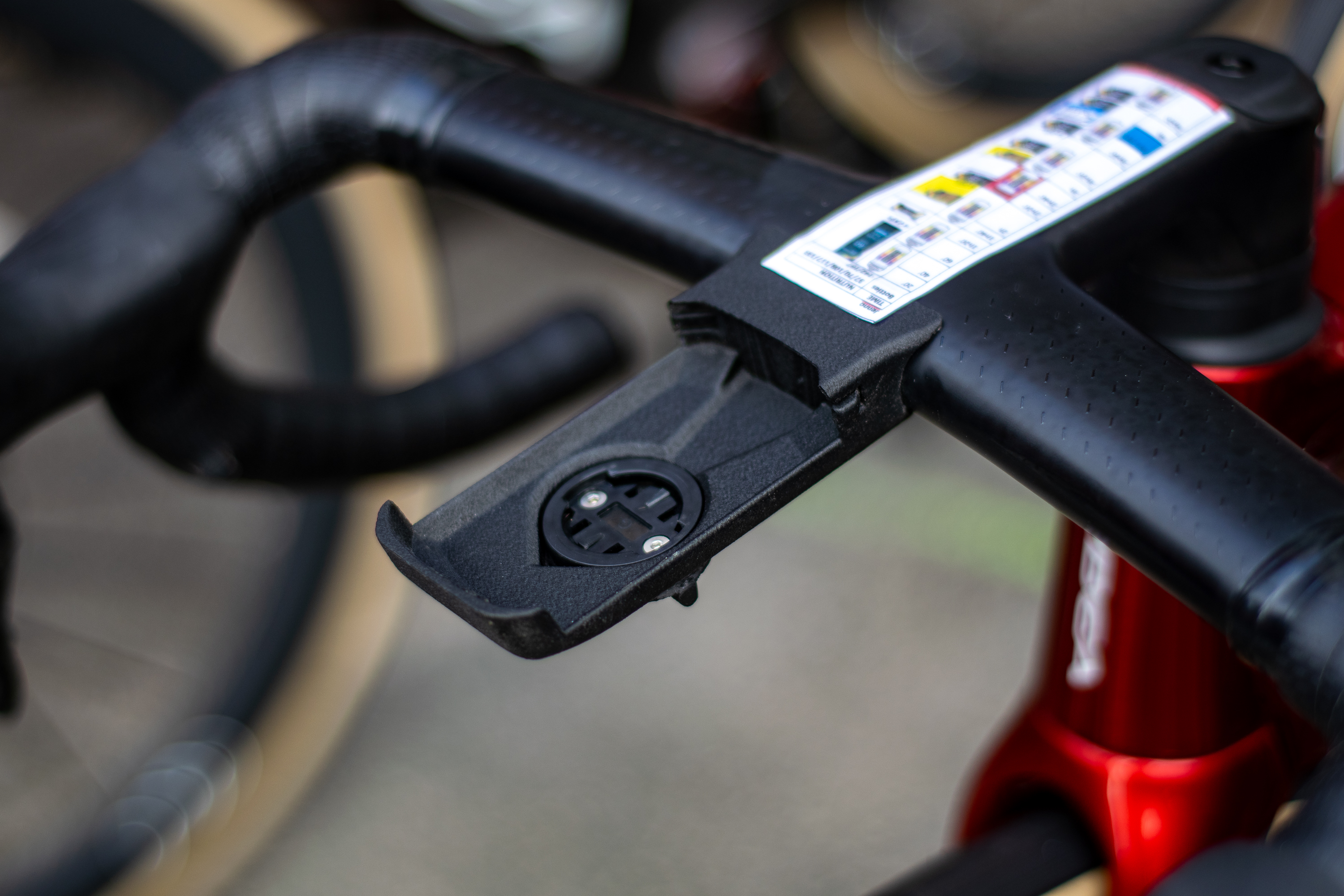 Closeup of the handlebar computer mount on the Lotto bike
