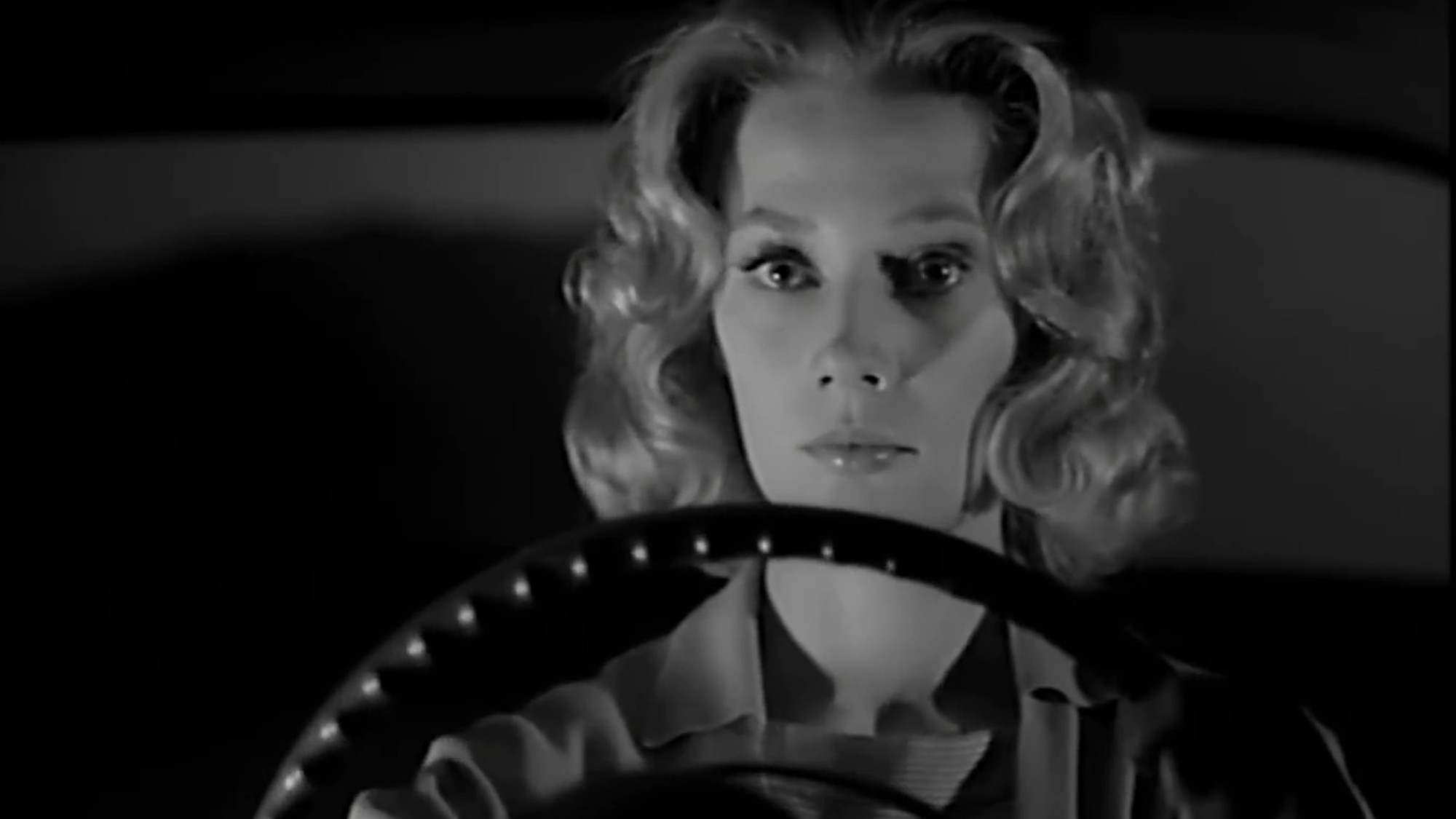 Candace Hilligoss driving late at night in Carnival of Souls