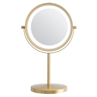 golden round shape mirror with stand