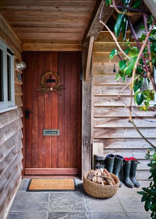front door of a wooden cabin home