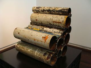 Chair made out of sections of old pipe