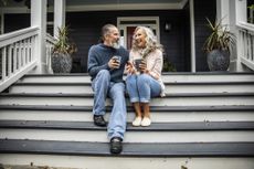 Couple enjoying coffee on the steps