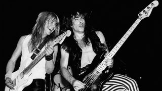 Black and white image of Dave Murray and Steve Harris performing live onstage on Killers World Tour on July 1, 1981