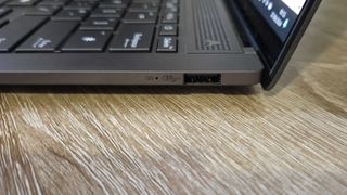 The Asus Zenbook S 14 viewed from its other side to show off one USB port