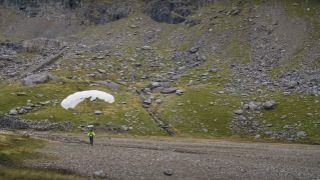 Mountain biker parachute landing on Snowdon