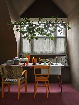 Dining room decorated for Christmas with hanging garland