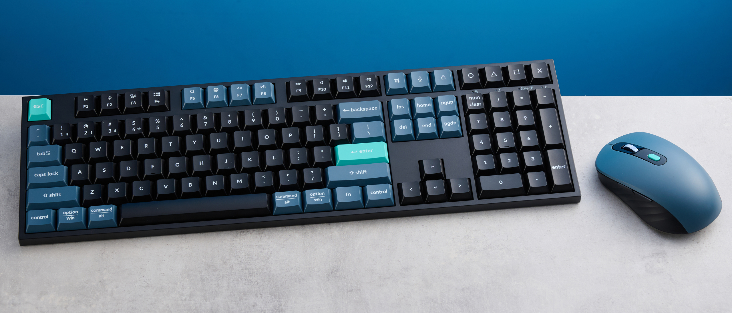 Keychron B36 keyboard and Keychron BM25 mouse photographed in front of a blue background. 