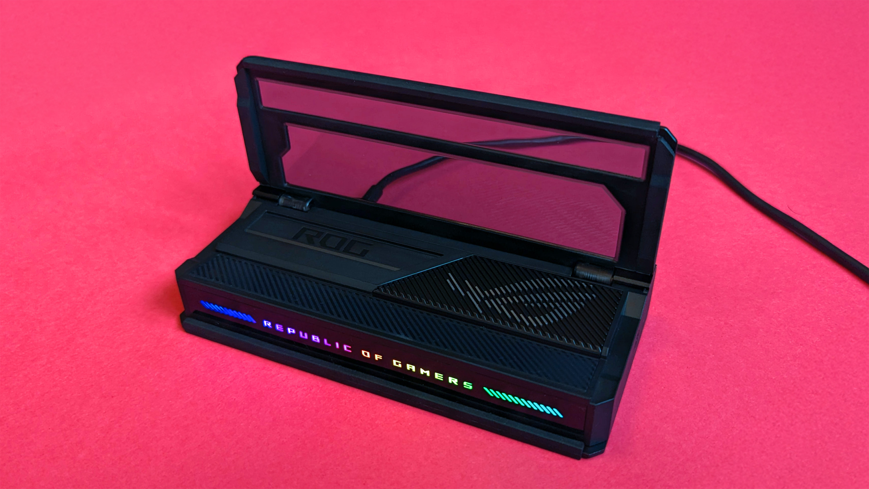 ASUS ROG Bulwark Dock (2025) on a pink card background