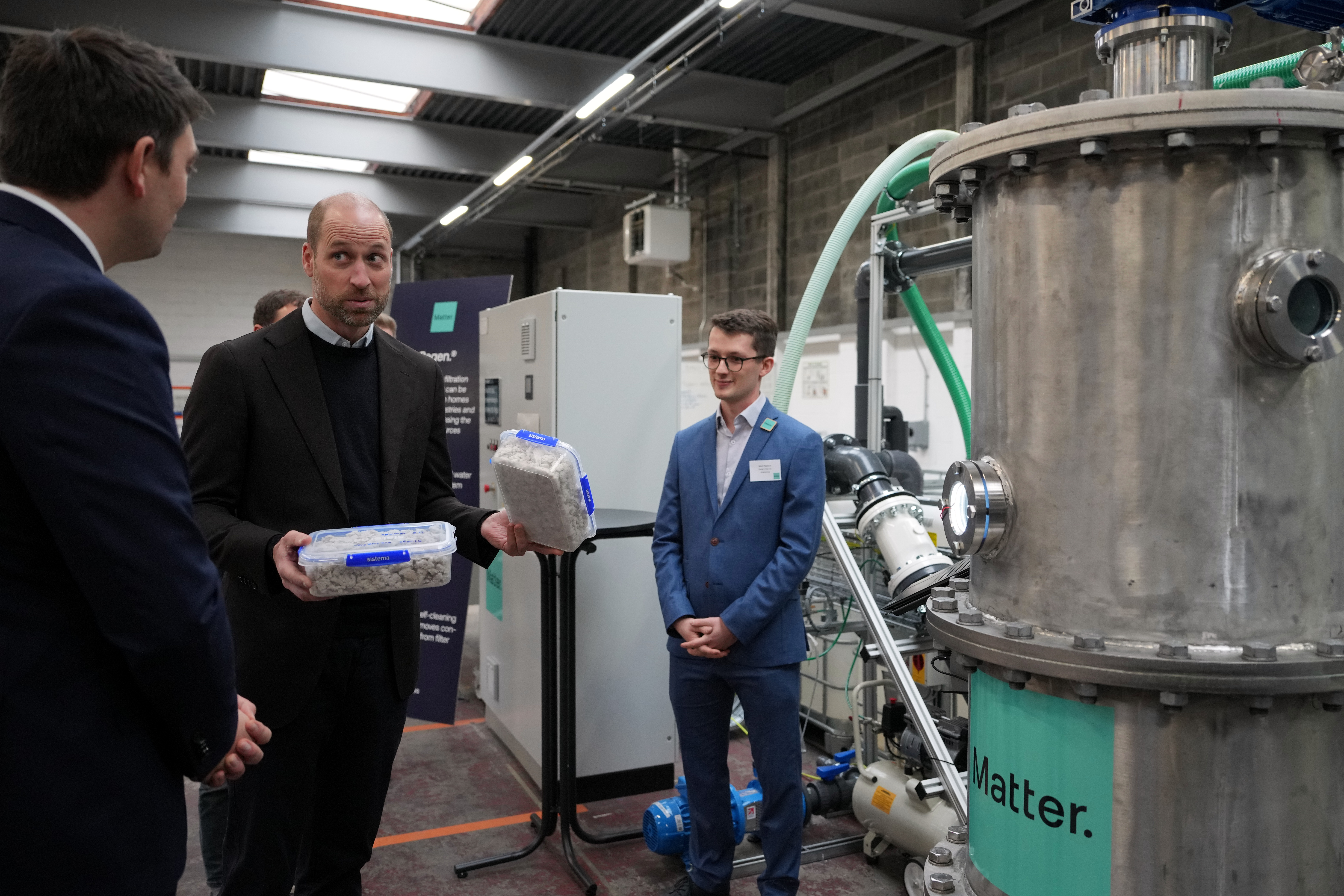 Britain's Prince William holds two boxes with waste products as he visits Matter, a pioneer in sustainable technology and a 2025 Earthshot Prize Finalist in Bristol, England, Thursday, Jan. 22, 2026.