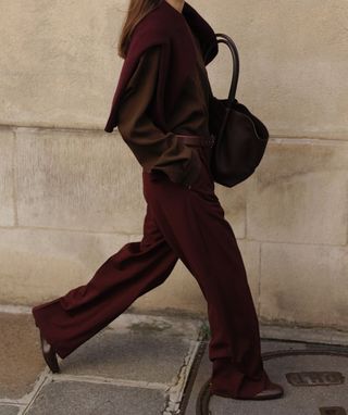 @modedamour wearing burgundy trousers and shirt