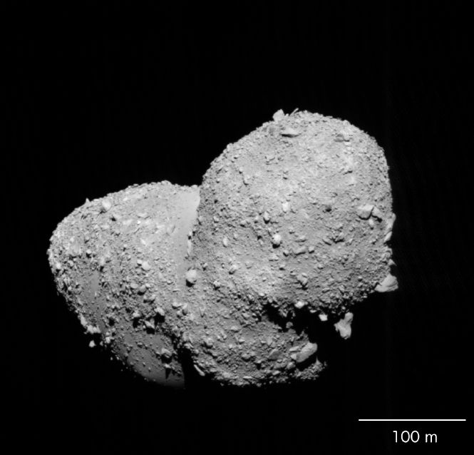 Asteroid Itokawa takes center stage in this photo from the Japan Aerospace Exploration Agency&#039;s Hayabusa spacecraft taken in October 2005. An analysis of samples collected by Hayabusa have revealed the origins of Itokawa, scientists say.