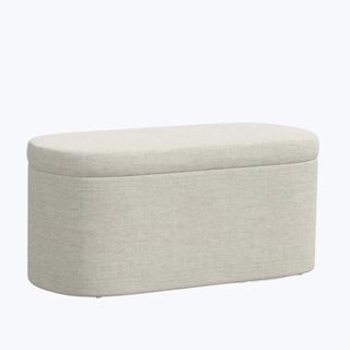 A long linen storage bench on a white background