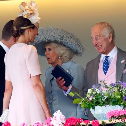 King Charles laughing talking to Harriet Sperling and Peter Phillips