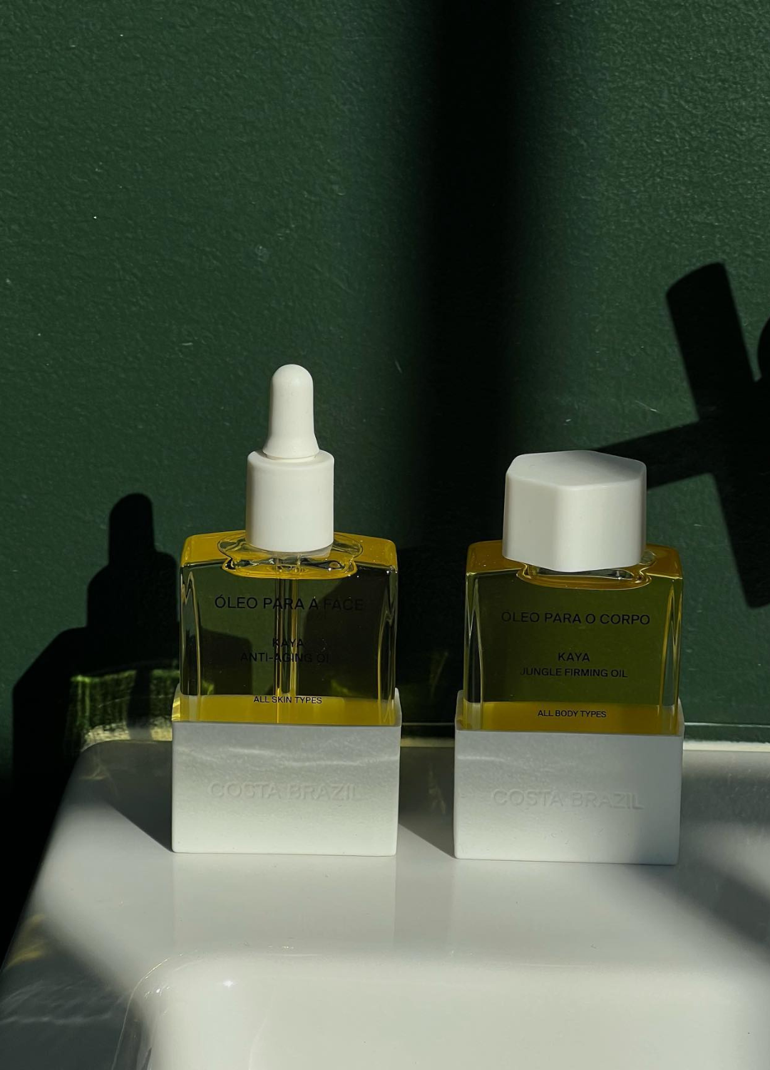 A photo of bodycare bottles with droppers by @alicezielasko