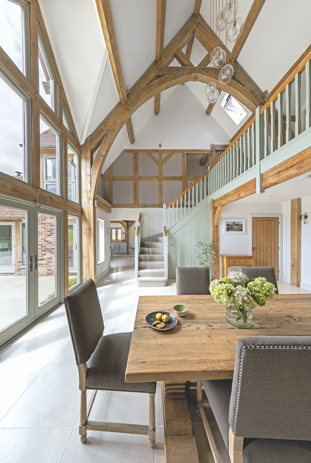 dining hall room with staircase in oak house