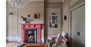 neutral living room with coral painted fireplace
