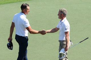 Stenson and Donald shake hands on the 18th after their round
