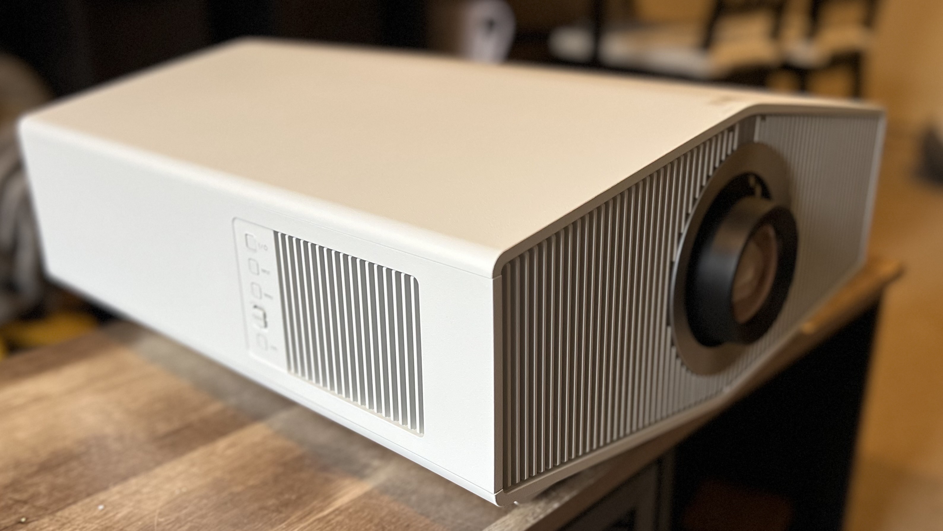 Sony BRAVIA Projector 8 (VPL-XW6100ES) placed on a wooden coffee table