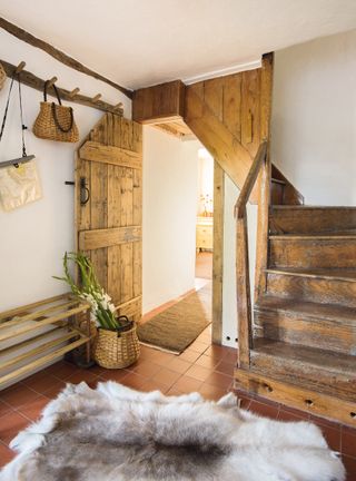 Hall and staircase in a renovated rustic cottage