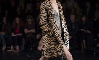 Model wearing tiger print cardigan jacket