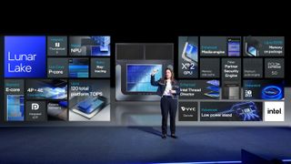 Michelle Johnston Holthaus, Intel's EVP of Client Computing Group, speaks on stage in front of a large display of upcoming Intel products