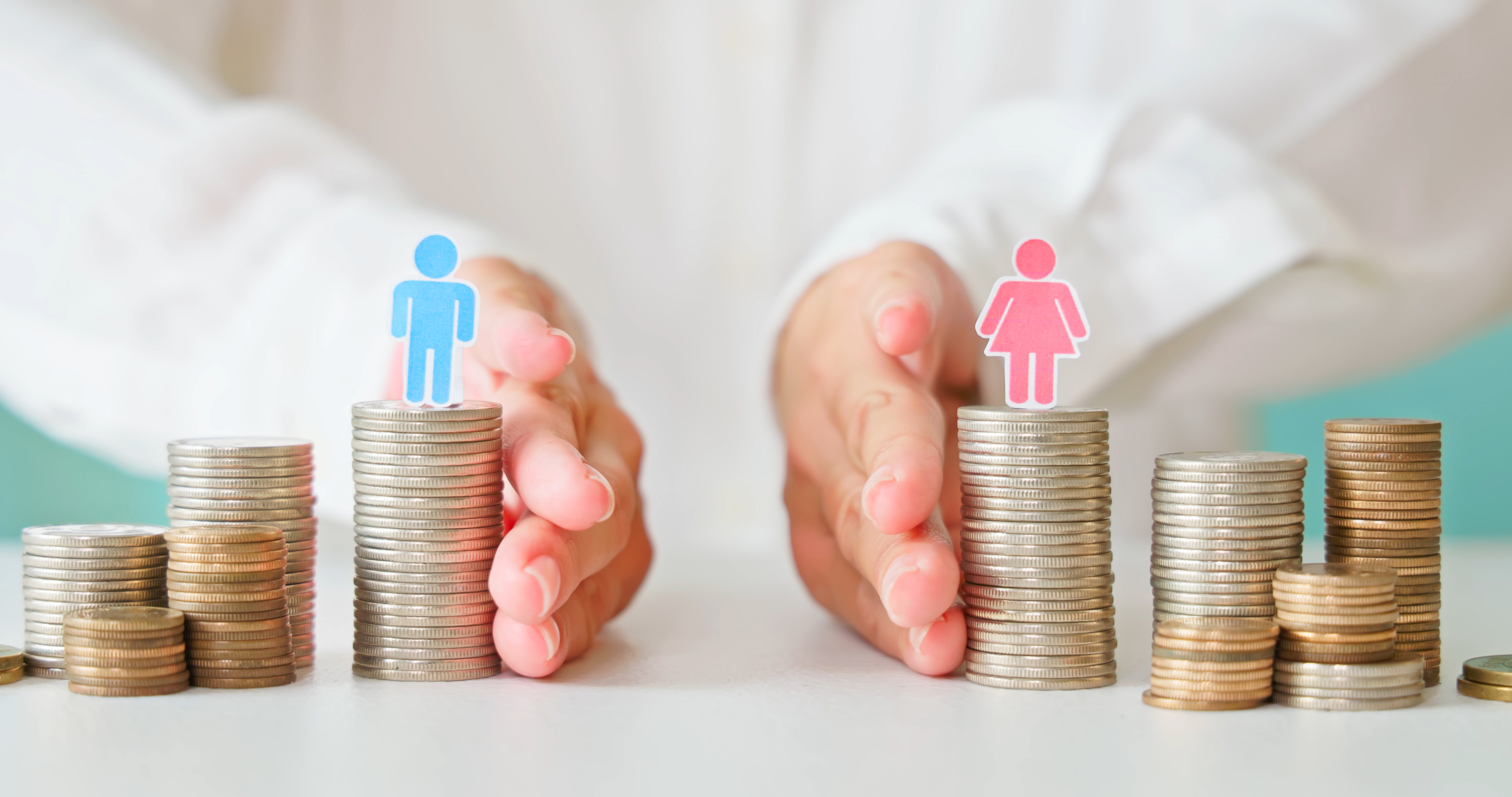 Splitting two piles of money, each with a male/female figure on them