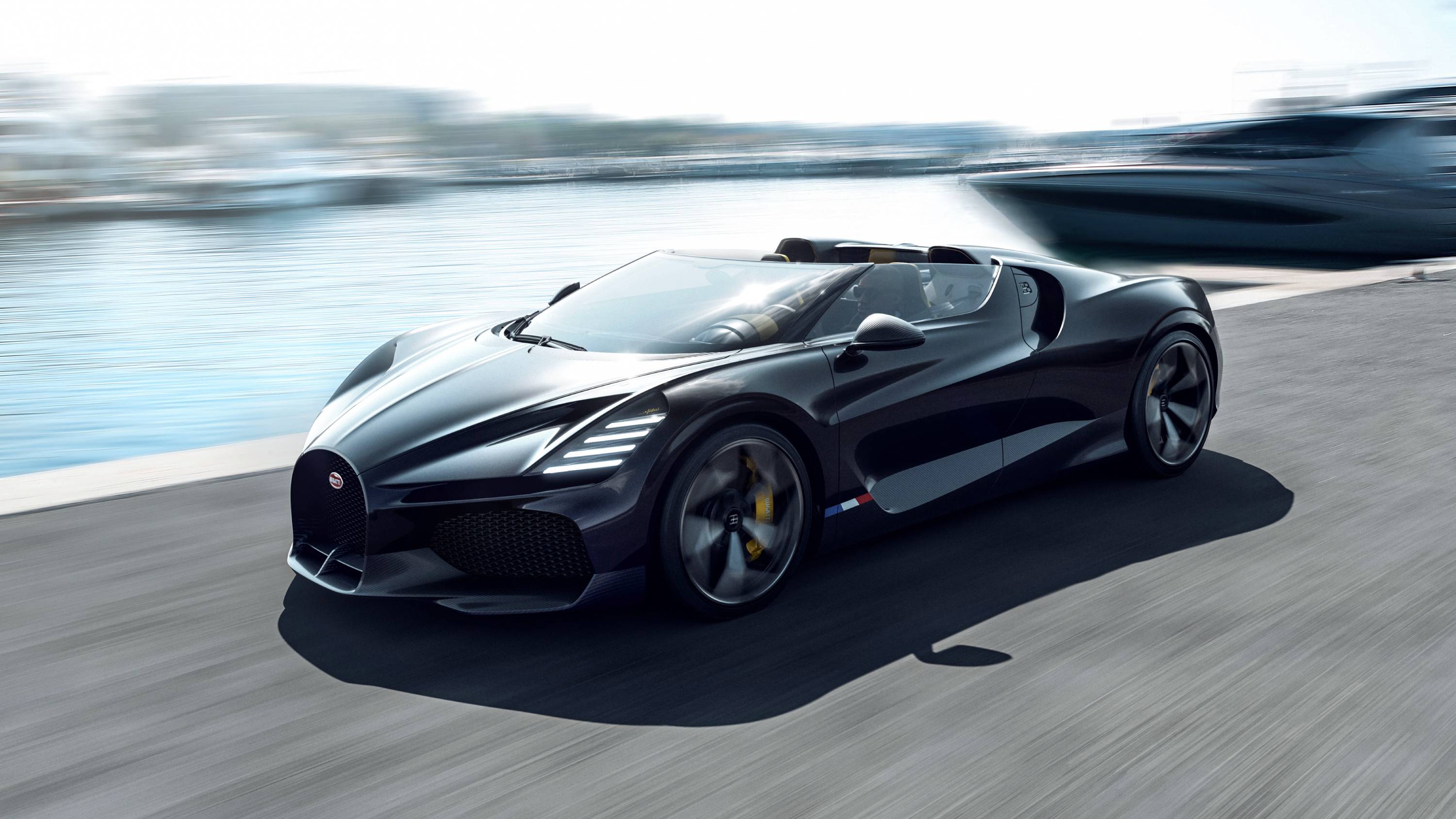 Bugatti W16 Mistral on road beside water