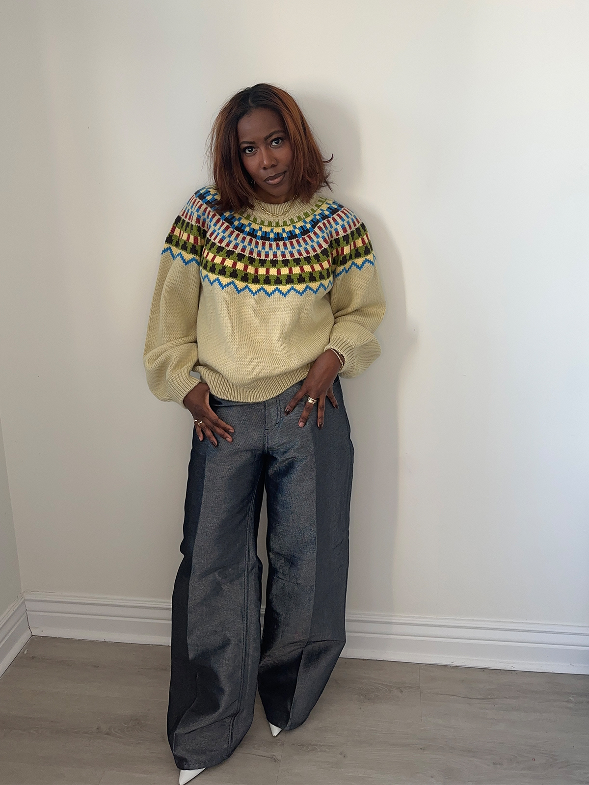 Tiffany Reid wearing Fair Isle sweater and jeans from her fashion editor guide to holiday hosting.